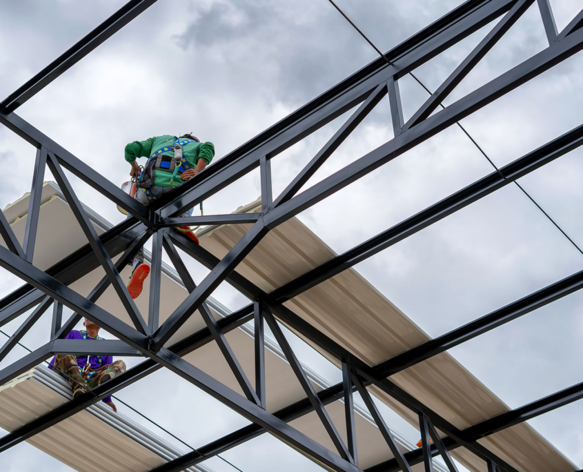 Workers On Industrial Roof