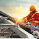 Worker Drilling On New Roof Tiles