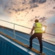 Worker Inspecting Roof